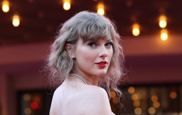 FILE PHOTO: Taylor Swift attends a premiere for Taylor Swift: The Eras Tour in Los Angeles
