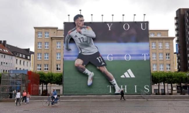 A huge Adidas advert of Florian Wirtz in Dortmund city centre.