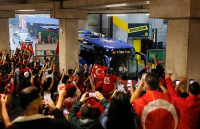 Turkish fans welcome their team bus into the ground before the 2024 European Champio<em></em>nship group game between Turkey and Georgia.