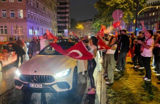 Turkish fans celebrate their victory on the streets of Dortmund city centre after their team’s 2024 European Champio<em></em>nship group game victory over Georgia.