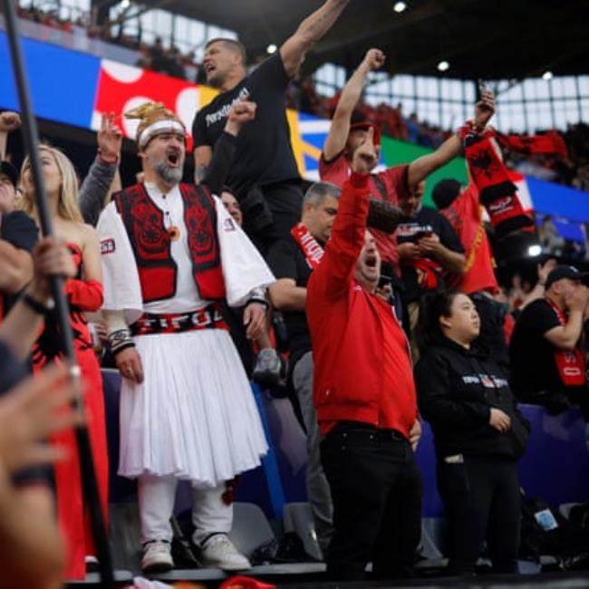 Albanian fans cheer their team before Italy v Albania.