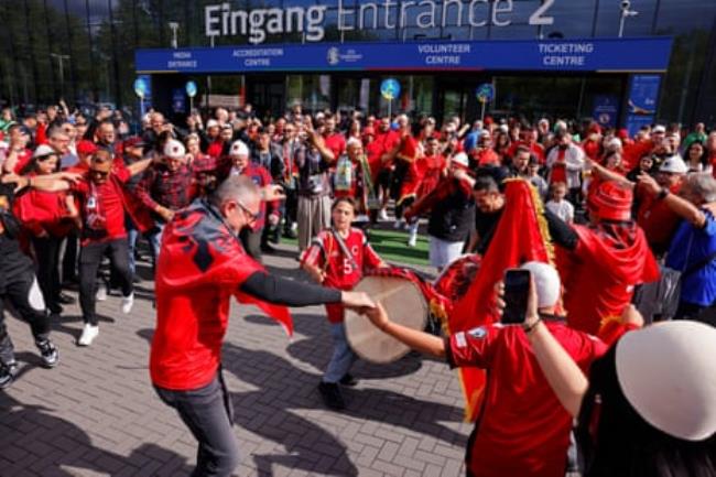 Albania fans dance outside the stadium before the group game between Italy and Albania.
