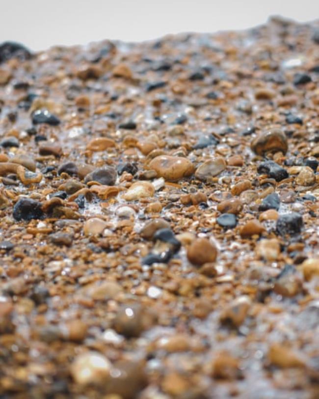 Close up of pebbles on the edge of the water