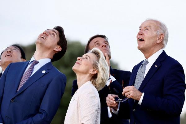 U.S. President Joe Biden, Canada's Prime Minister Justin Trudeau, France's President Emmanuel Macron, Japan's Prime Minister Fumio Kishida, ?and European Commission President Ursula von der Leyen look on during a skydiving demo<em></em>nstration on the first day of the G7 summit, in Savelletri, Italy.