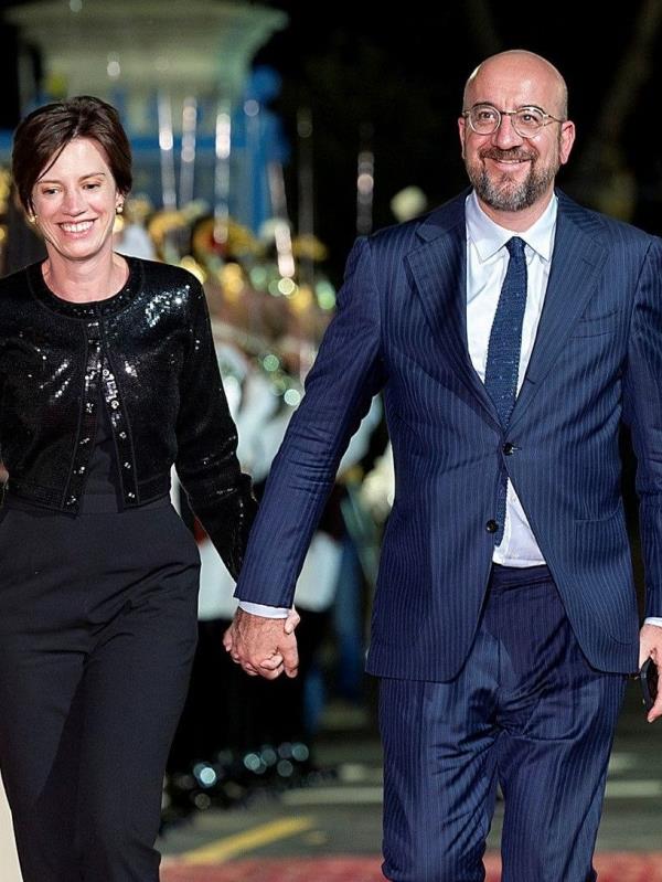 European Council President Charles Michel and his wife Amelie Derbaudrenghien arrive to attend a dinner at Swabian Castle in Brindisi, Italy.