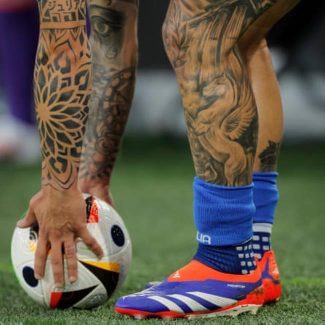 The tattooed arms and legs of Italian defender Federico Dimarco during the 2024 European Champio<em></em>nship group game between Italy and Albania.