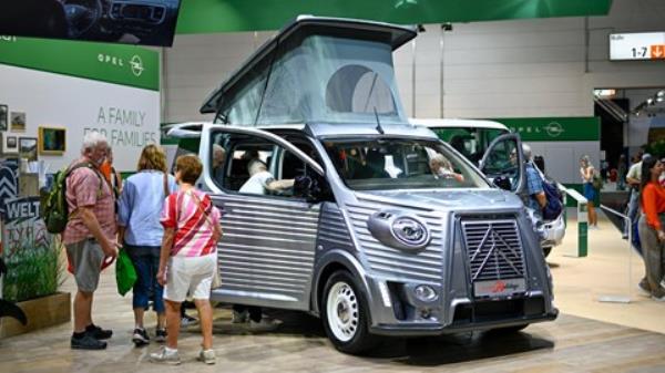 2023 Dusseldorf Caravan Salon - premium RV with Mazda MX-5 in garage