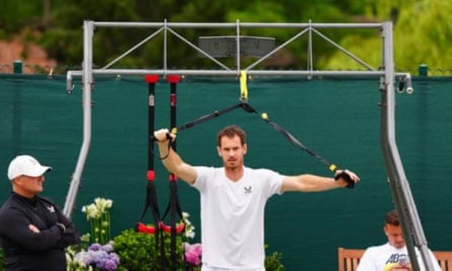 Andy Murray warms up for practice at Wimbledon
