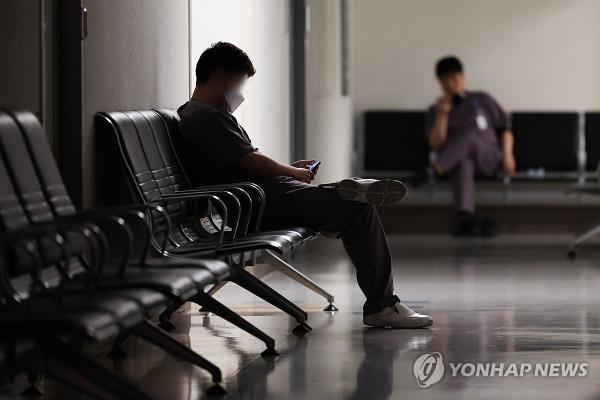 In this file photo, a medical staff member takes a break at a general hospital in Seoul on May 1, 2024. (Yonhap)