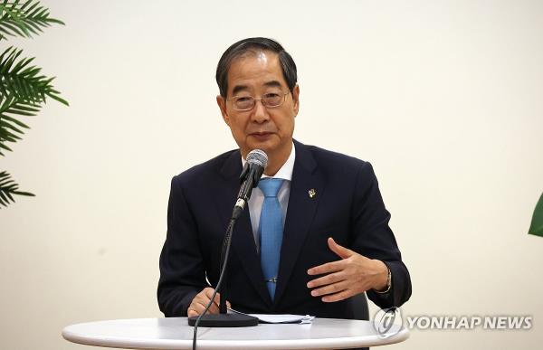 Prime Minister Han Duck-soo speaks to reporters at the annex of the government complex in Seoul on June 4, 2024. (Yonhap)