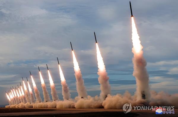 This photo, carried by North Korea's official Korean Central News Agency on May 31, 2024, shows the North staging a firing drill involving 600 mm super-large multiple rocket launchers the previous day, guided by leader Kim Jong-un. (For Use o<em></em>nly in the Republic of Korea. No Redistribution) (Yonhap)