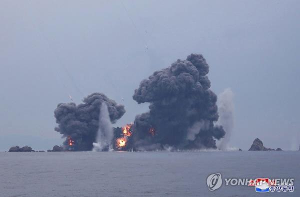 This photo, carried by North Korea's official Korean Central News Agency on May 31, 2024, shows the North staging a firing drill involving 600 mm super-large multiple rocket launchers the previous day, guided by leader Kim Jong-un. (For Use o<em></em>nly in the Republic of Korea. No Redistribution) (Yonhap)