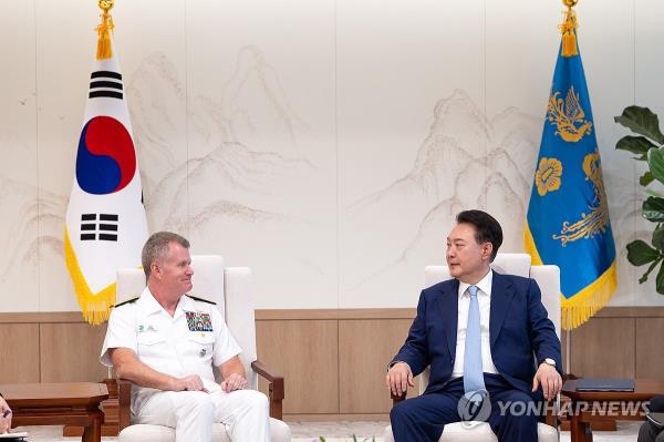 President Yoon Suk Yeol (R) meets with new U.S. Indo-Pacific Command Commander Adm. Samuel Paparo at the presidential office in Seoul on May 30, 2024, in this photo provided by the office. (PHOTO NOT FOR SALE) (Yonhap)