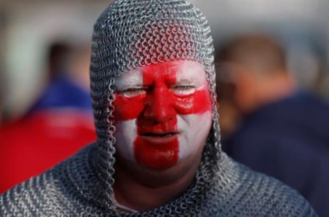 An England fan wearing chain mail walks into the ground before the 2024 European Champio<em></em>nship group game between England and Serbia.