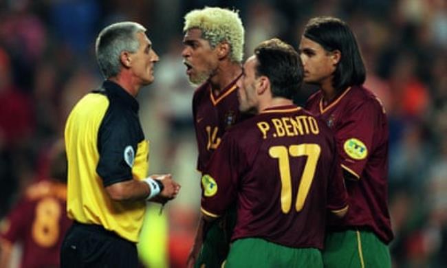 Abel Xavier (second left), Paulo Bento (second right) and Nuno Gomes talk angrily with referee Günter Benkö on the pitch