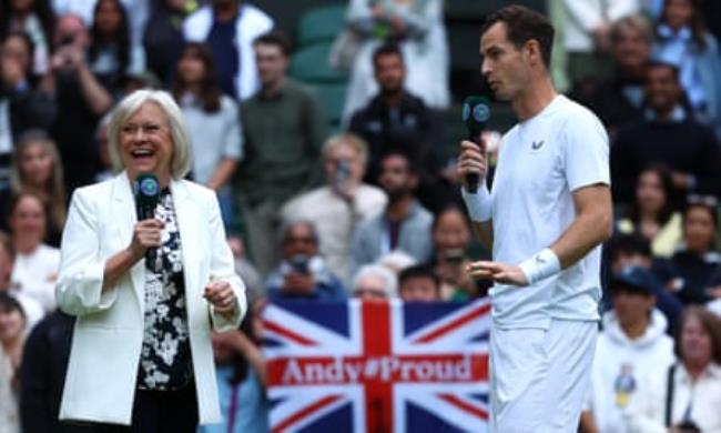 Andy Murray is interviewed by Sue Barker after his doubles match with his brother Jamie