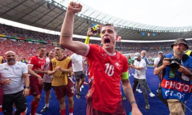 Switzerland captain Granit Xhaka celebrates after the win over Italy