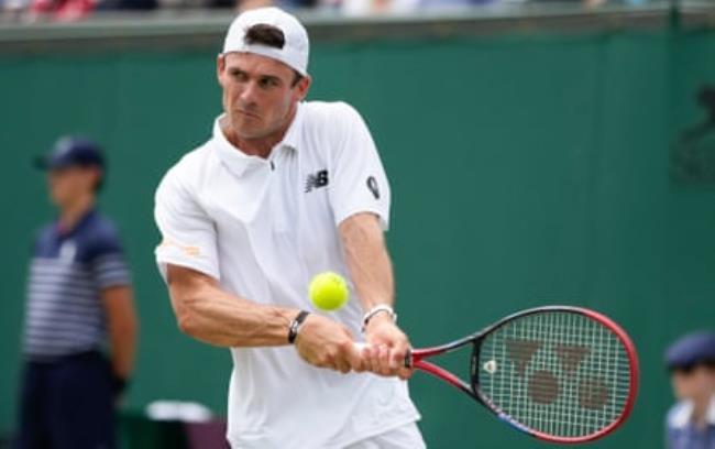 Tommy Paul plays a forehand against Alexander Bublik