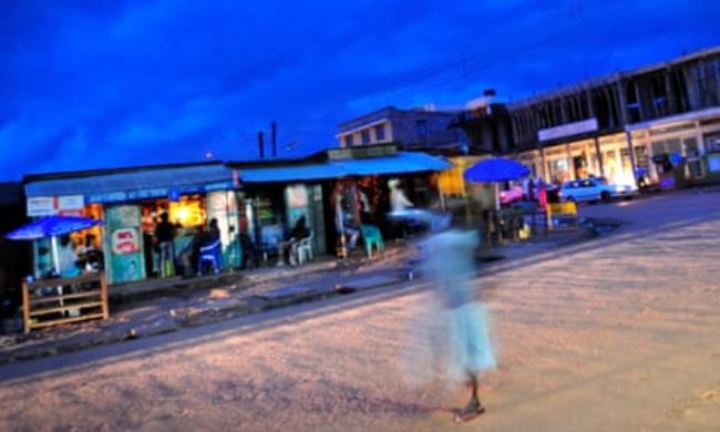 An evening street scene in the city of Gulu, Uganda.