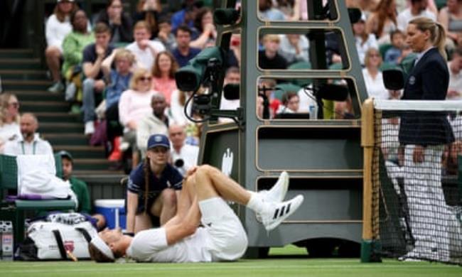 Alexander Zverev lies hurt after taking a tumble by the net post