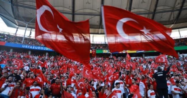 Supporters of Turkey cheer prior to kick-off.