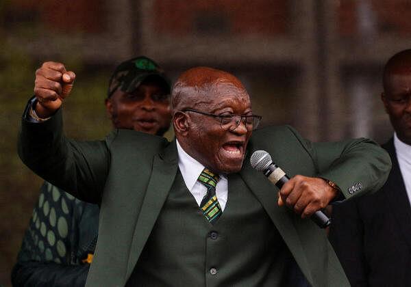 Former South African President Jacob Zuma sings for supporters at the high court in Pietermaritzburg.