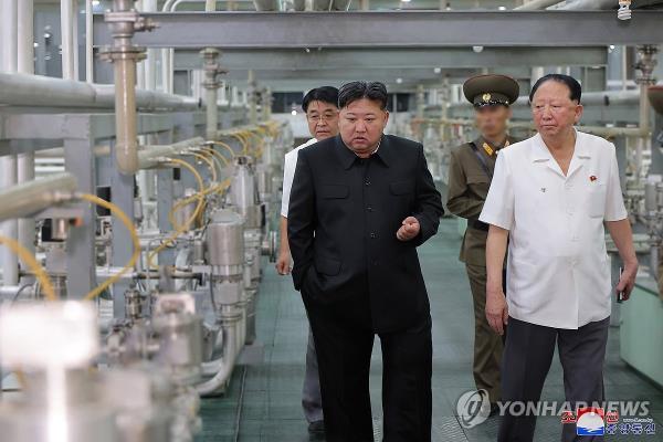 This photo, carried by North Korea's official Korean Central News Agency on Sept. 13, 2024, shows the North's leader Kim Jong-un (front, L) inspecting the Nuclear Weapons Institute and the production ba<em></em>se of weapon-grade nuclear materials. (For Use o<em></em>nly in the Republic of Korea. No Redistribution) (Yonhap)