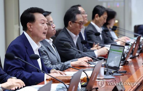 President Yoon Suk Yeol (L) speaks during a Cabinet meeting held at the presidential office in Seoul on Sept. 10, 2024. 