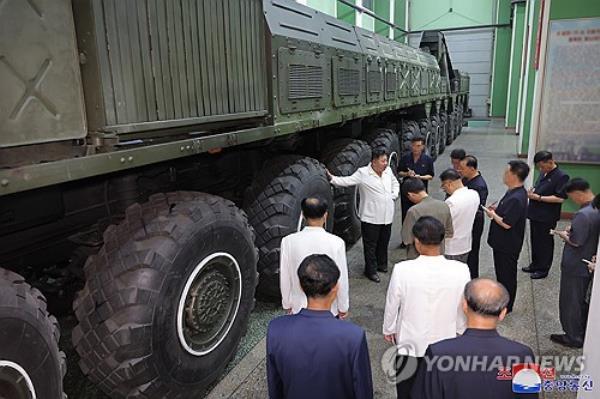 North Korean leader Kim Jong-un (C) inspects a newly-unveiled transporter erector launcher during his visit to a defense industrial enterprise in this photo released by the Korean Central News Agency on Sept. 8, 2024. (For Use o<em></em>nly in the Republic of Korea. No Redistribution) (Yonhap)