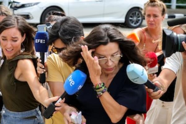 Silvia Bronchalo, Daniel's mother, walks to attend a court before a Thai court jailed for life her son.