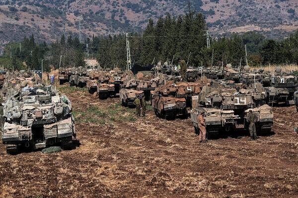 Israeli armoured military vehicles in formation, amid cross-border hostilities betweenÊHezbollahÊand Israel, in northern Israel, September 27, 2024.