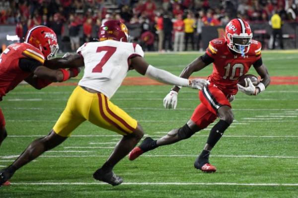 Maryland WR Octavian Smith Jr tries to slow USC S Kamari Ramsey as Maryland WR Tai Felton runs the ballin the third quarter at SECU Stadium. (Kim Hairston/Staff)