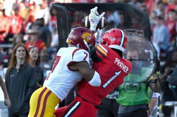 Kamari Ramsey, USC safety, tackles Maryland WR Kaden Prather as he tries to hold on to the ball, but the pass is incomplete in the first half of college football at SECU Stadium. (Kim Hairston/Staff)