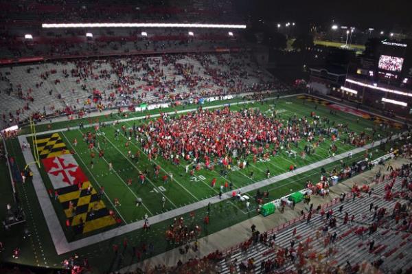 Oct 19, 2024: Maryland football fans celebrate their come from behind 29-28 victory over USC on the field at SECU Stadium. (Kim Hairston/Staff)