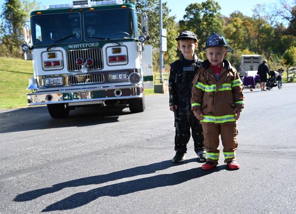 Levi, 5, and Landon Warnick, 4, of Delta pose in their outfits while visiting Whiteford Volunteer Fire Company during the open house on Saturday. (Brian Krista/staff photo)