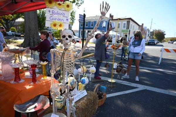 A skeleton welcomes visitors to the vendor space for Robin's Garden as people shop during Havre de Grace Fall Fest on Saturday. (Brian Krista/staff photo)