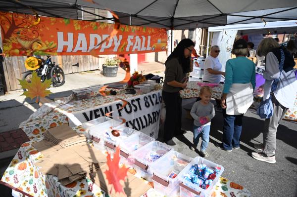 Families collect free crafts for children, distributed by VFW Post 8126, during the Havre de Grace Fall Fest on Saturday. (Brian Krista/staff photo)