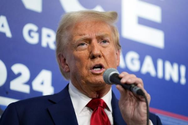 Republican presidential nominee former President Do<em></em>nald Trump speaks as he visits a campaign office, Friday, Oct. 18, 2024, in Hamtramck, Mich. (AP Photo/Evan Vucci)