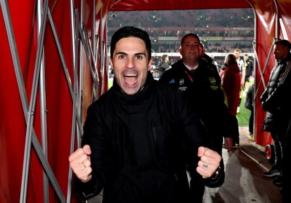 Mikel Arteta is pictured with a huge smile