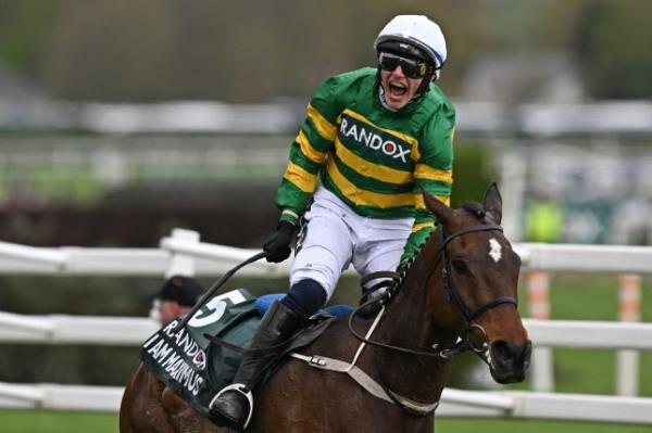 Jockey Paul Townend rides I Am Maximus past the finish line to win the Grand Natio<em></em>nal Steeple Chase on the final day of the Grand Natio<em></em>nal Festival horse race meeting at Aintree Racecourse in Liverpool, north-west England, on April 13, 2024. (Photo by Paul ELLIS / AFP) (Photo by PAUL ELLIS/AFP via Getty Images)