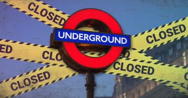 A Lo<em></em>ndon underground sign with closed banners behind it 