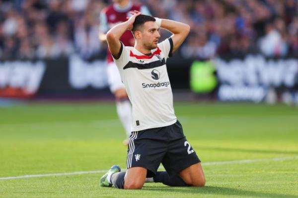 Diogo Dalot of Manchester United reacts after missing a chance on goal during the Premier League match between West Ham United FC and Manchester United