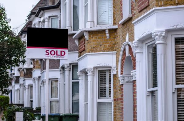 British houses with sold sign