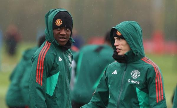 Kobbie Mainoo and Alejandro Garnacho of Manchester United in action during a first team training session at Carrington Training Ground