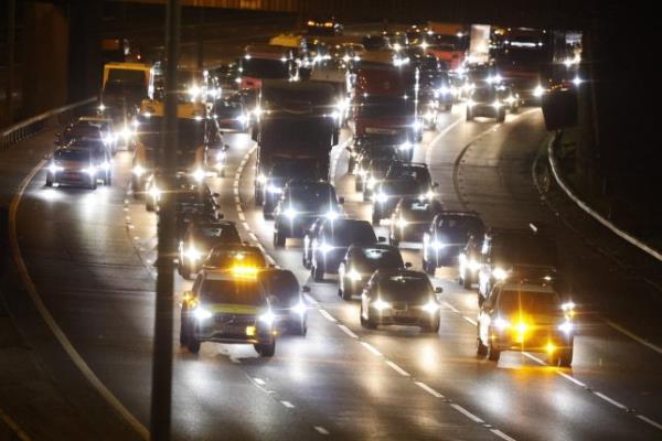 Mandatory Credit: Photo by Peter MacDiarmid/REX/Shutterstock (14392491i) Traffic is held as a roadblock is put in place on the M25 near Chertsey in Surrey as the motorway is closed. The M25 is closing for the first time in its history for two days for roadworks at the junction with the A3. London's orbital motorway is closing from junction 10 to junction 11 from 9PM on Friday night until 6AM on Mo<em></em>nday to allow the removal of a footbridge and the installation of a new overhead gantry gantry. Heavy traffic is expected on local roads. M25 closure, Chertsey, Surrey, UK - 15 Mar 2024