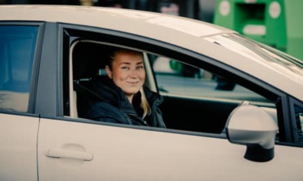 Sophie Orton sitting in her white car