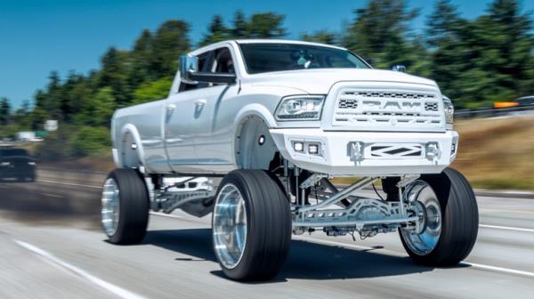 A heavily (and most likely illegally) modified diesel pickup truck "rolling coal."