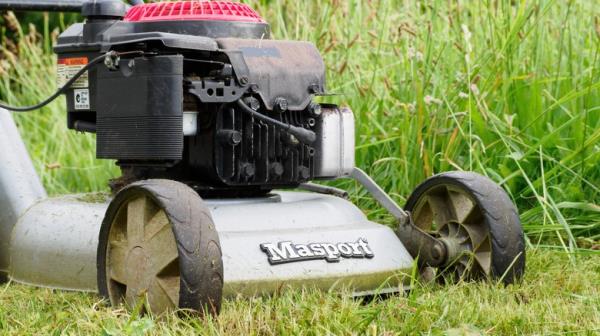 Lawn mower sitting in grass