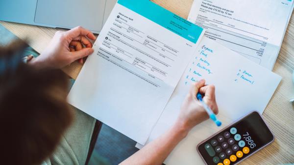 Woman looking over insurance paperwork