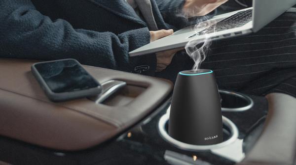 person using humidifier in car